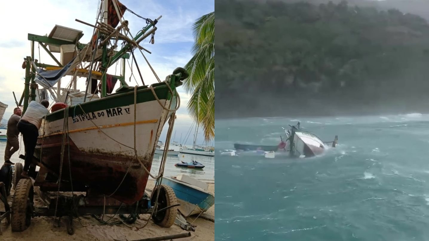 Barco de pescador é retirado do mar em Ilhabela